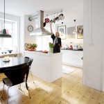 This is Sine, in her kitchen. The family spends a lot of time together in here. Sometimes they pull the chairs to the window and have afternoon tea there This is Sine, in her kitchen. The family spends a lot of time together in here. Sometimes they pull the chairs to the window and have afternoon tea there